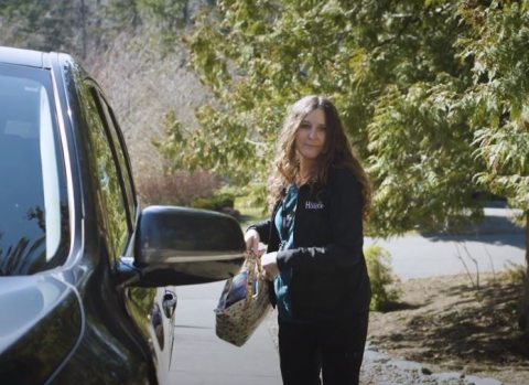 Tricia Griffin closes car door and prepares to go to patient home