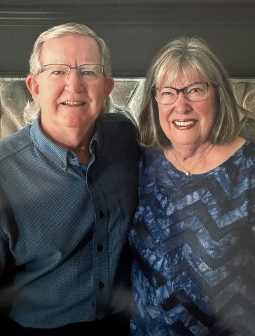 Skip Gibson and his wife Pam smiling at the camera