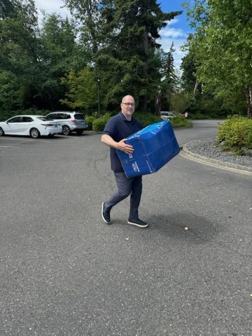 Morgan carrying a box
