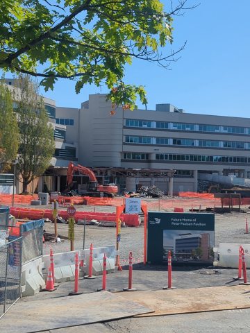 Structural sheers and other heavy equipment demolishing the former front entrance 