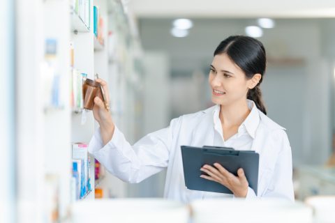 A Pharmacy Tech working on a whiteboard.