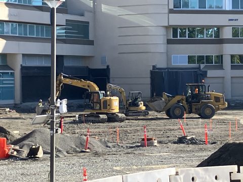 Construction vehicles working on the grounds of St. Joseph Medical Center