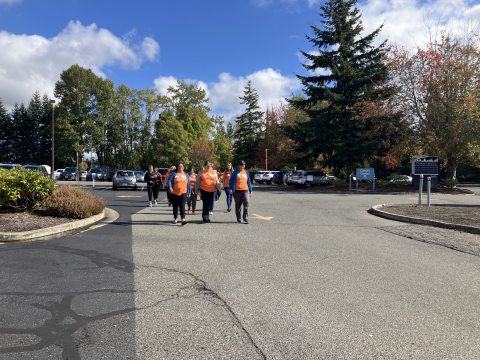 Orange T-shirt group of three walking