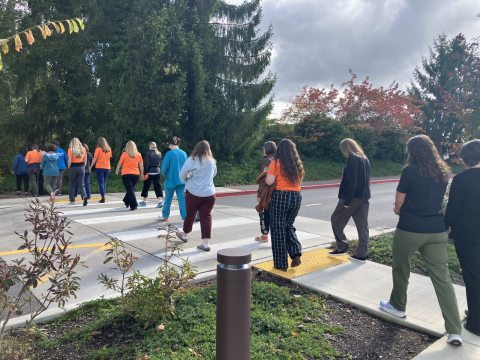 Orange T-shirt group walking