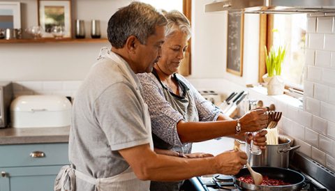 older couple cooking together