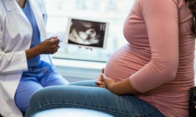 Doctor shares ultrasound image with pregnant patient