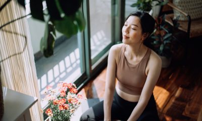 woman sitting on the floor doing a meditation