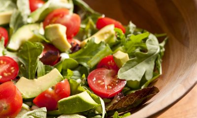 Bowl of lettuce, cherry tomato and avocado chunks