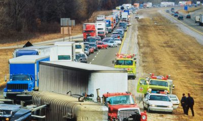 Large collision on freeway with many vehicles backed up