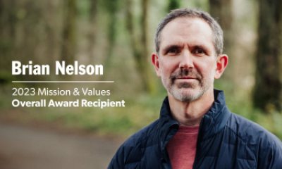 Brian Nelson outside on a trail in a forest