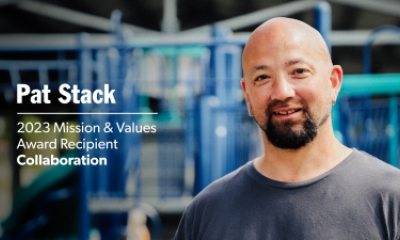 Pat Stack outside in front of children's playground