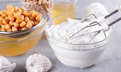 bowl of garbanzo beans, merengue pucks and whipped aquafaba