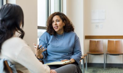 Two women discuss goals 