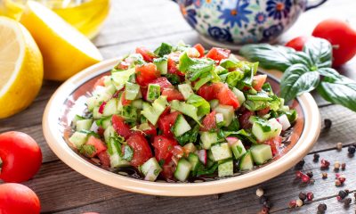 Chopped cucumber and tomato salad in a bowl.