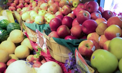 Fruit stand full of apples in baskets
