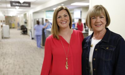 Kate Young and Kathy Corwin pose near the nurses station of Three North at PeaceHealth Southwest Medical Center in Vancouver