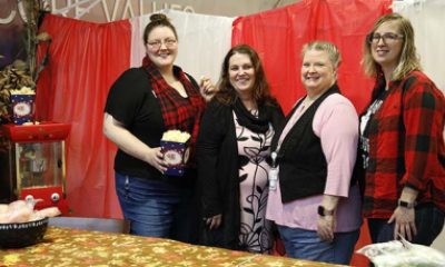members of PeaceHealth's patient financial service team pose in front of Patti's Pumpkin Patch booth
