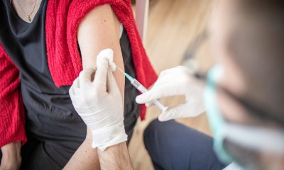 A provider administers a vaccine in the arm of a patient