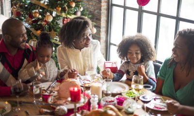 A smiling family enjoying a holiday meal together