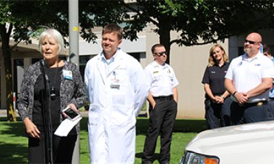 PeaceHealth providers and security standing outside of a medical facility