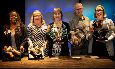 Group photo of Mission & Value Award Winners with their awards