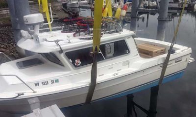 Boat being hoisted in or out of the water