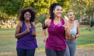 group of three women running outside