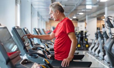 Man preparing to start walking on treadmill