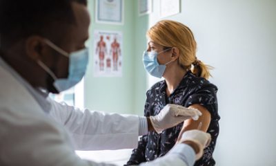 Doctor gives a shot to a woman