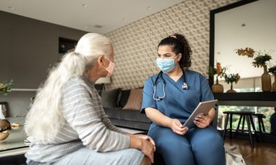 Woman speaking with caregiver