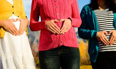 heart hands on pregnant bellies