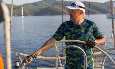 A man steering a boat