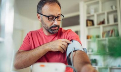 man checking blood pressure