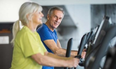 couple walking on treadmills