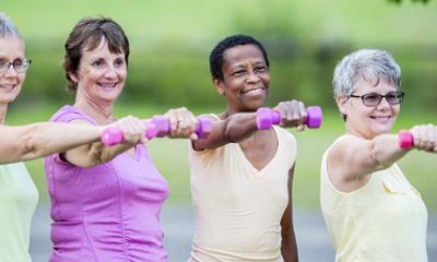 group of women working out with weights
