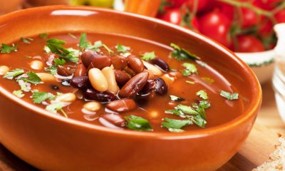 Bowl of chili soup garnished with cilantro