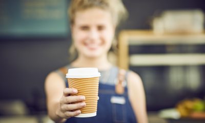 Barista handing a drink in first person view