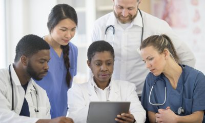 A group of providers reading a chart