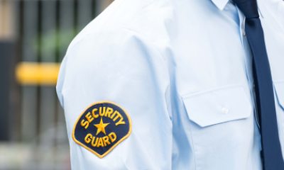 Close-up of patch on security guards shoulder