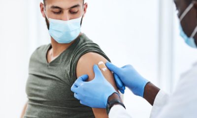 Young man getting a flu shot