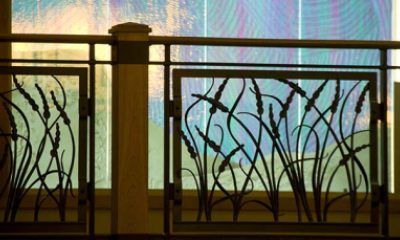 stained glass and wrought-iron cattail railing by chapel in PeaceHealth Sacred Heart Medical Center at RiverBend