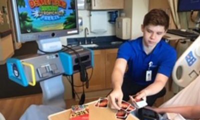 Zach Garrison plays cards with a patient