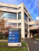 Photo of a sign for urgent care clinic in front of a building