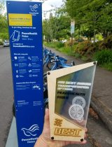 Photo of "PeaceHealth Rides" bicycle stand