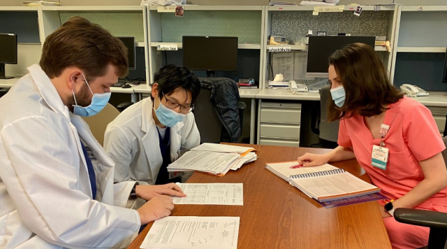 Pharmacy residents in the PGY2 program confer with a mentor