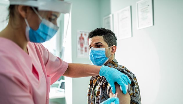 A healthcare provider administers a vaccine to a patient