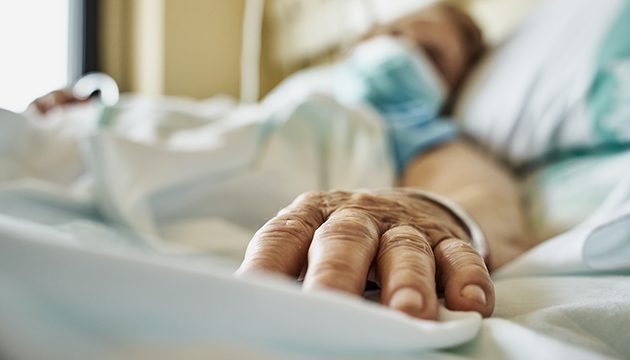 A patient lying in a hospital bed