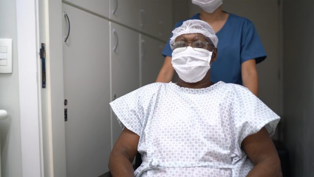 Patient in wheelchair before surgery.