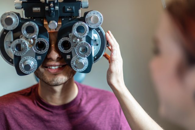 Young adult getting an eye exam.