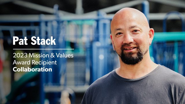 Pat Stack outside in front of children's playground